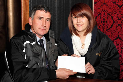 Harold McKee, Secretary, Northern Ireland Blue Cattle Club presents the proceeds of a collection at the Club's Spring Meeting to Naomi Gregg from Ahoghill. Naomi is raising funds for Friends of Romania and will be traveling there in the summer to help in an Orphanage.